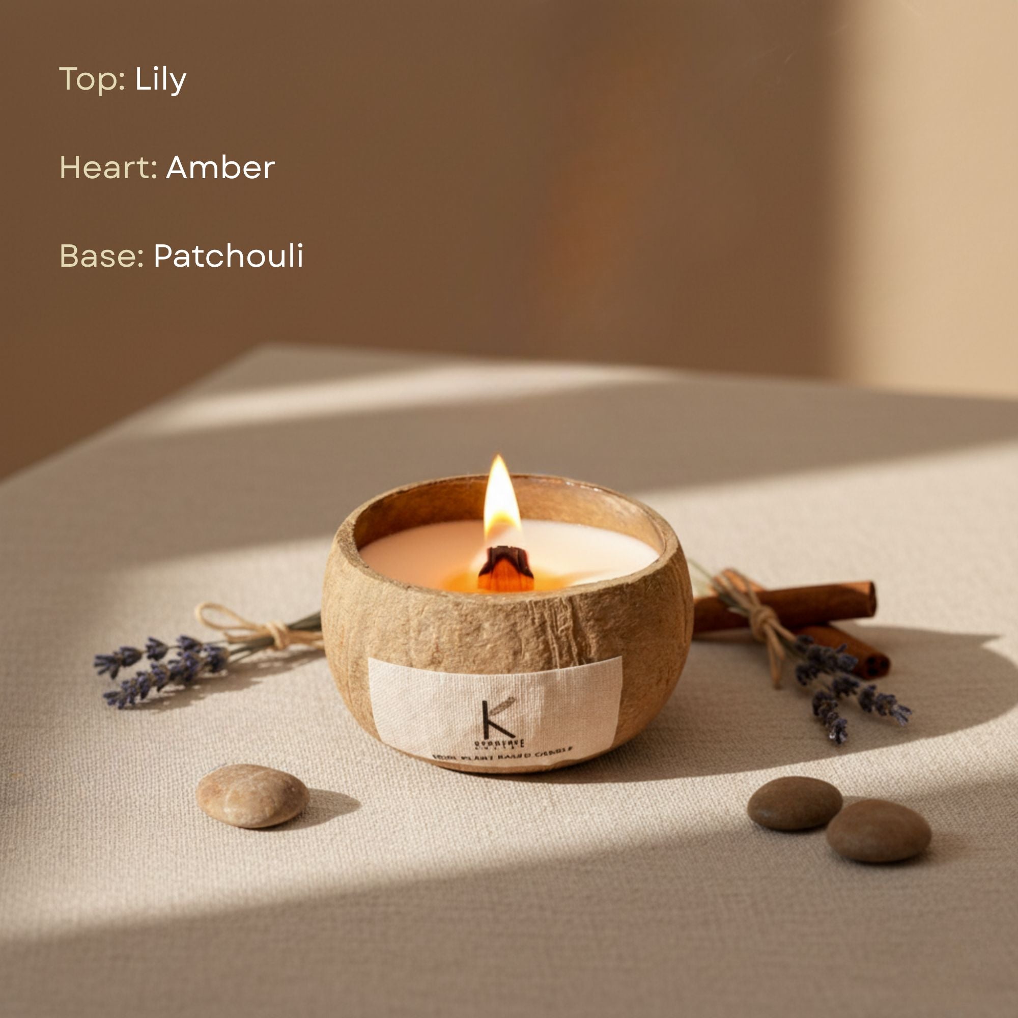 Vegan natural wax Candle in a coconut shell with lavender, cinnamon sticks, and stones on a neutral background