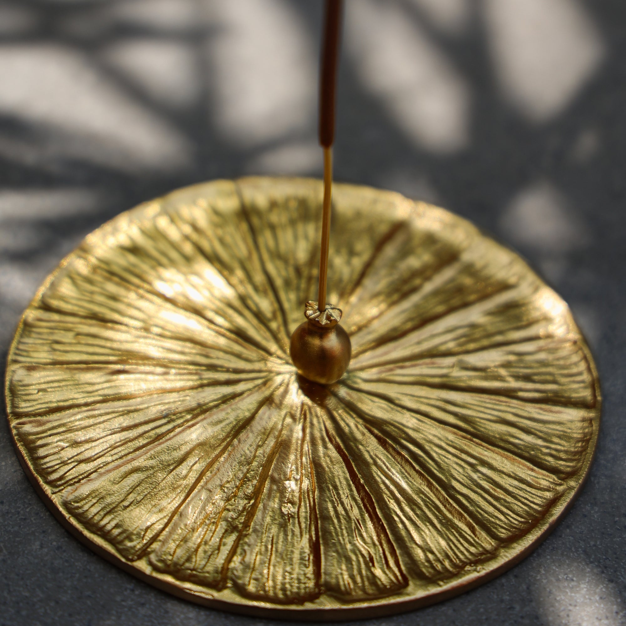 Luxury Gold brass incense holder comes with a ash catcher tray can be used as a decorative item on a dark background