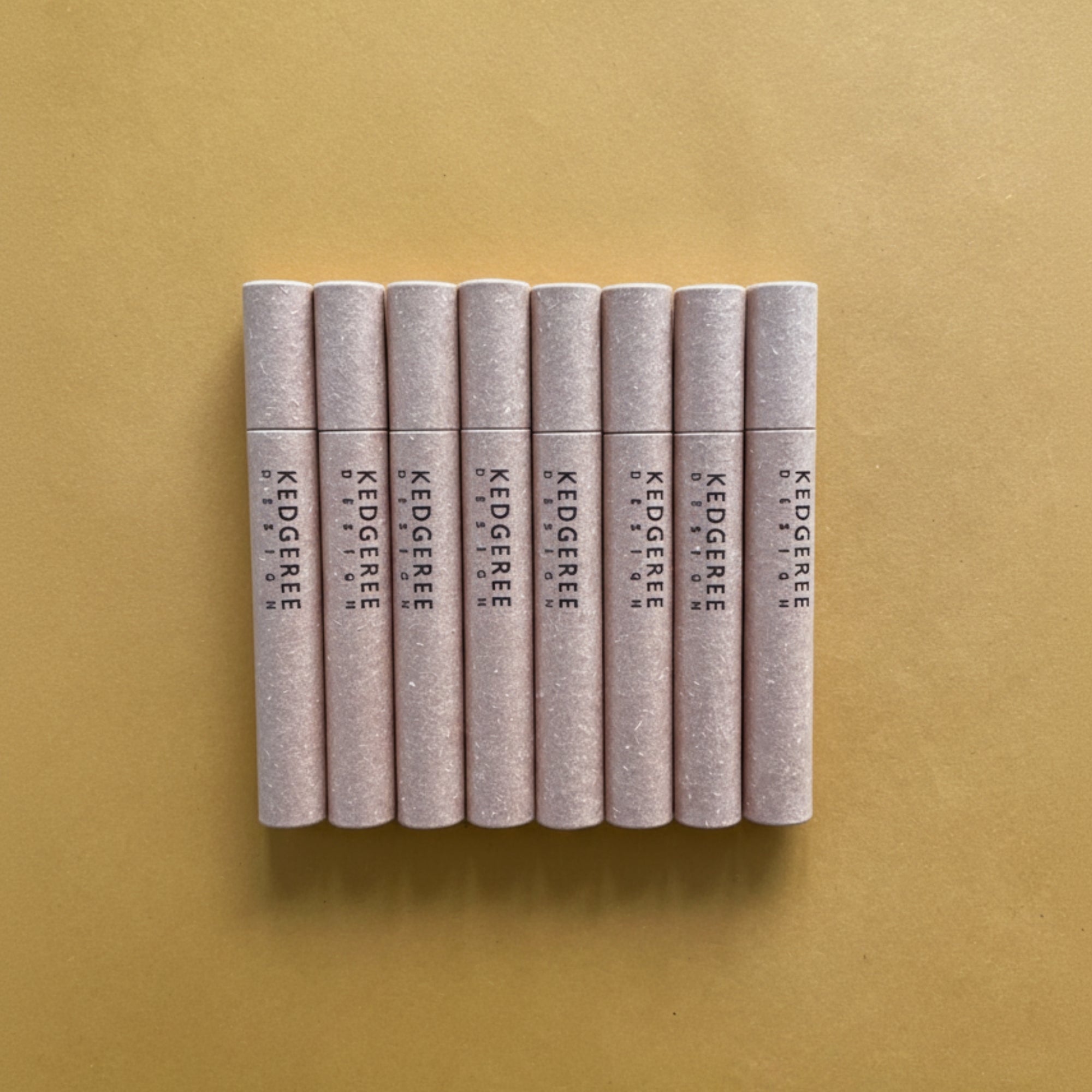 Kedgeree Design travel incense sticks with three fragrances in one - sandalwood, rose and agarwood placed against mustard yellow background