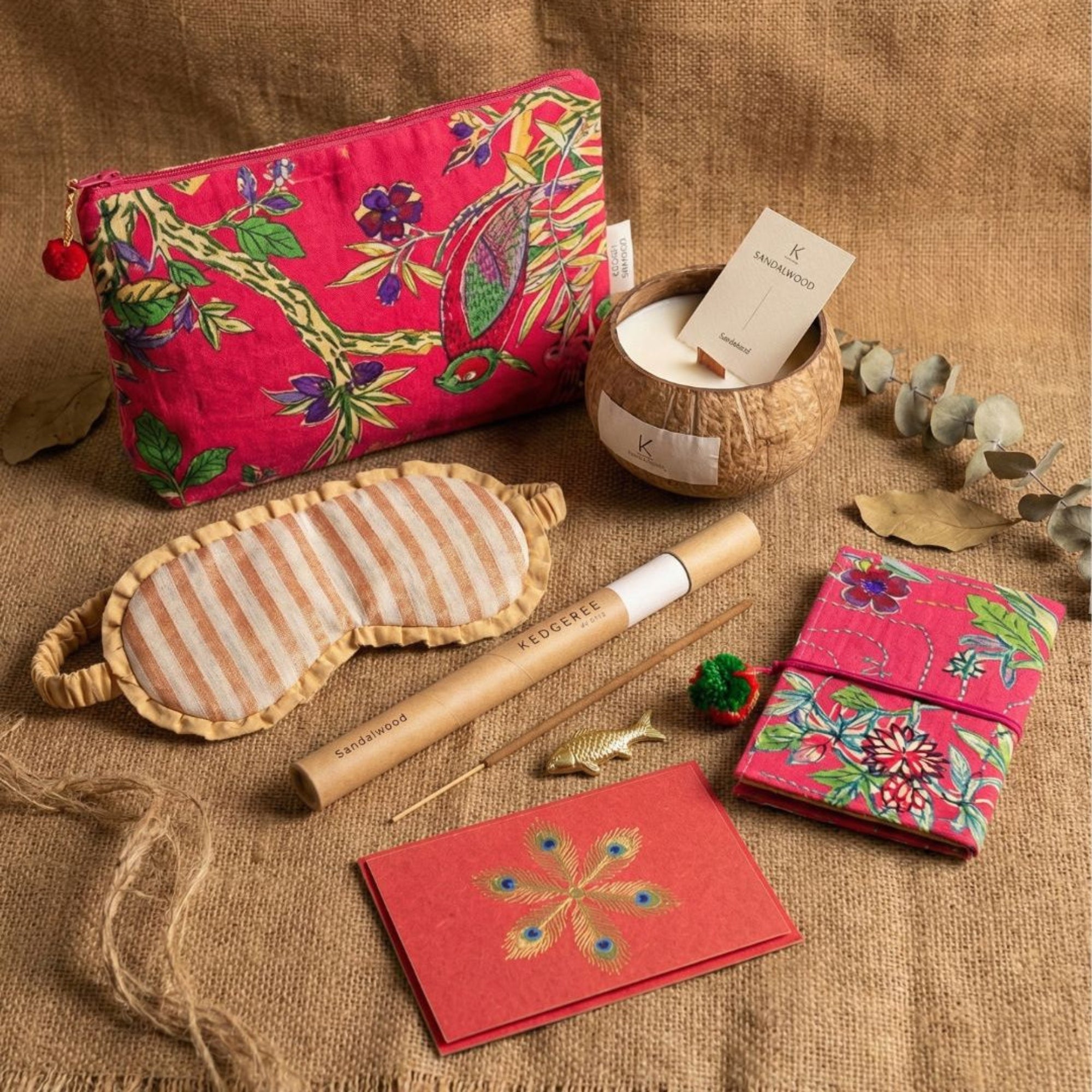 Christmas calm gift set including a handmade pouch, eye mask, vegan coconut shell candle, travel pouch, hand-rolled incense sticks and incense holder
