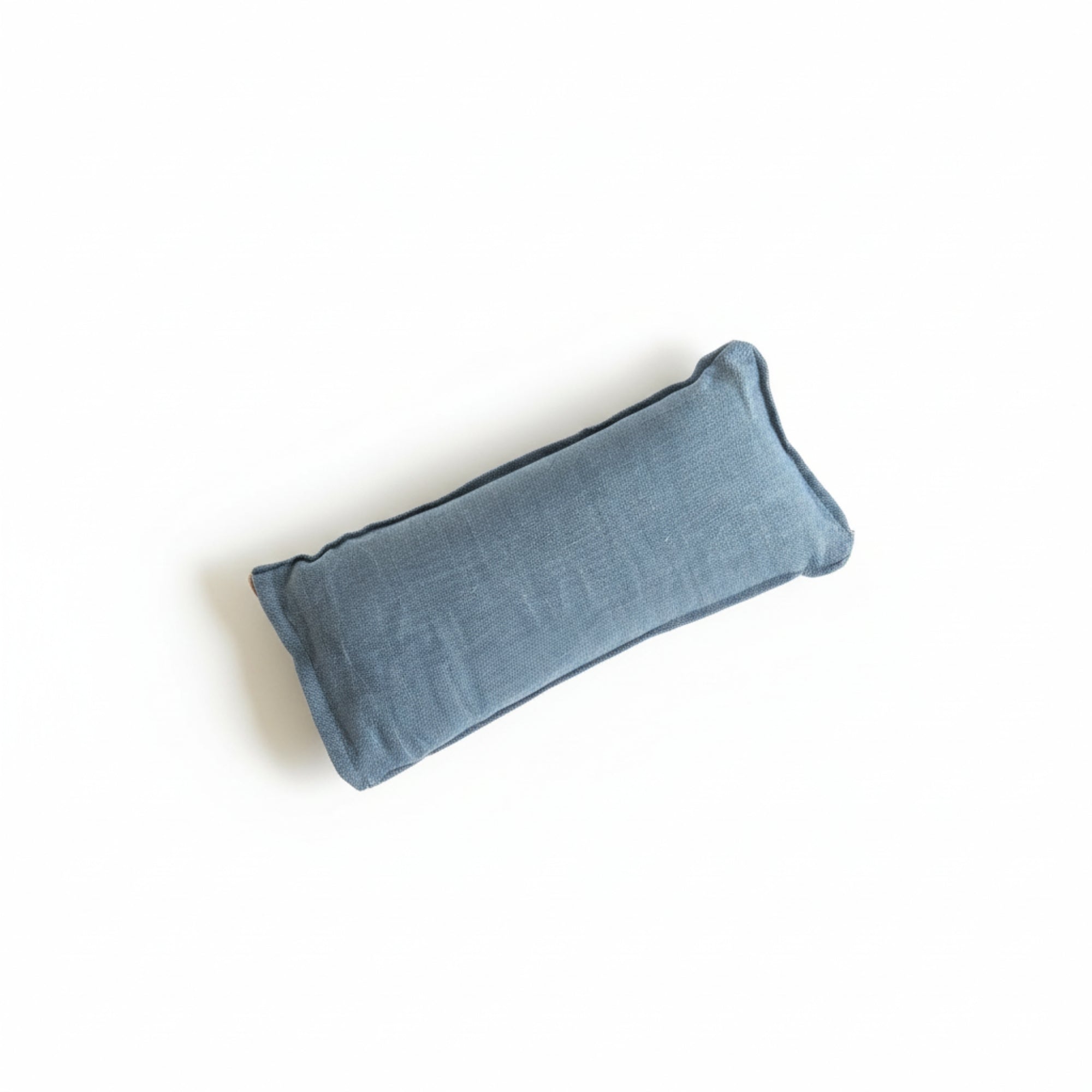 Blue scented eye pillow on a white background