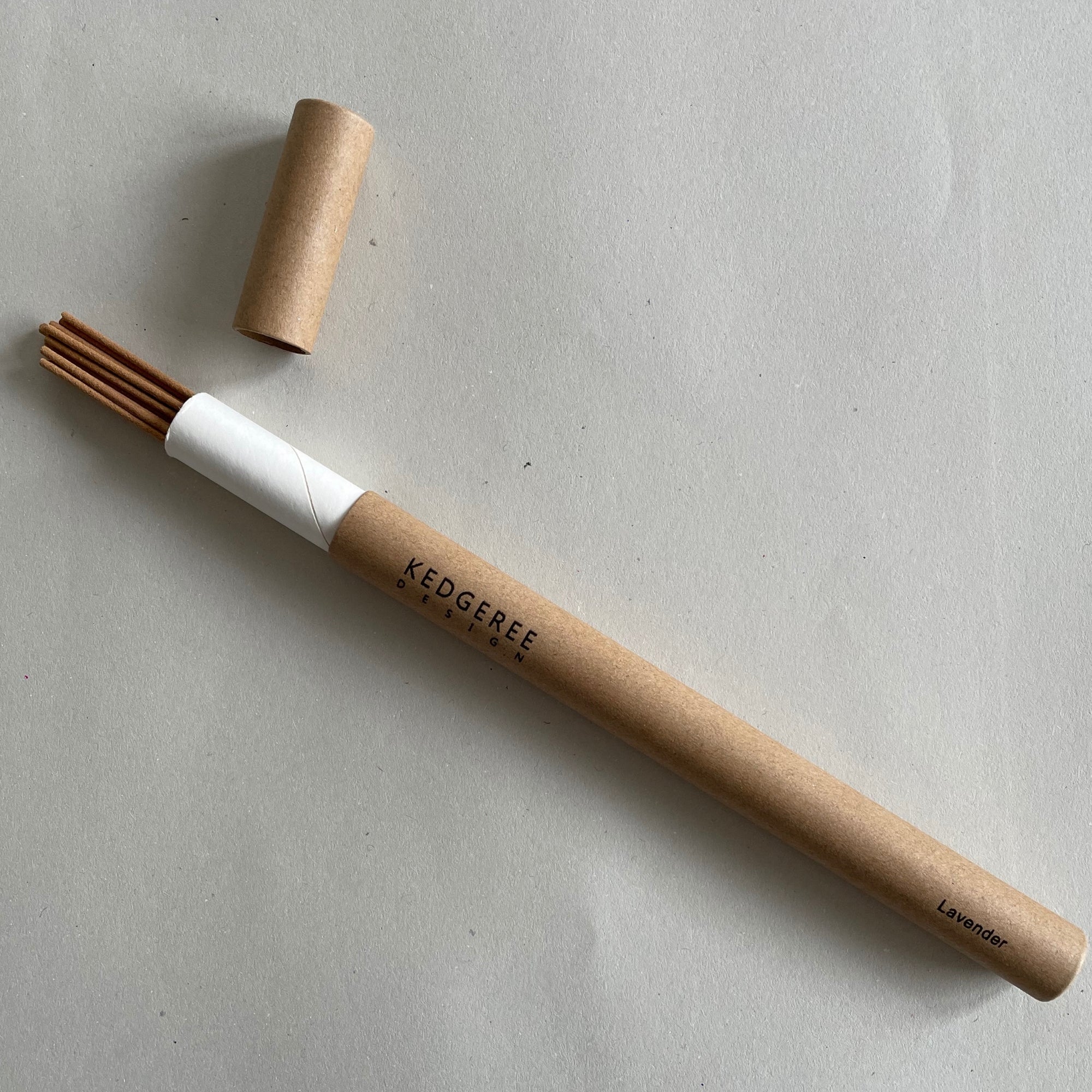Handrolled natural Kedgeree Design lavender fragrance incense holder placed against a light grey backdrop