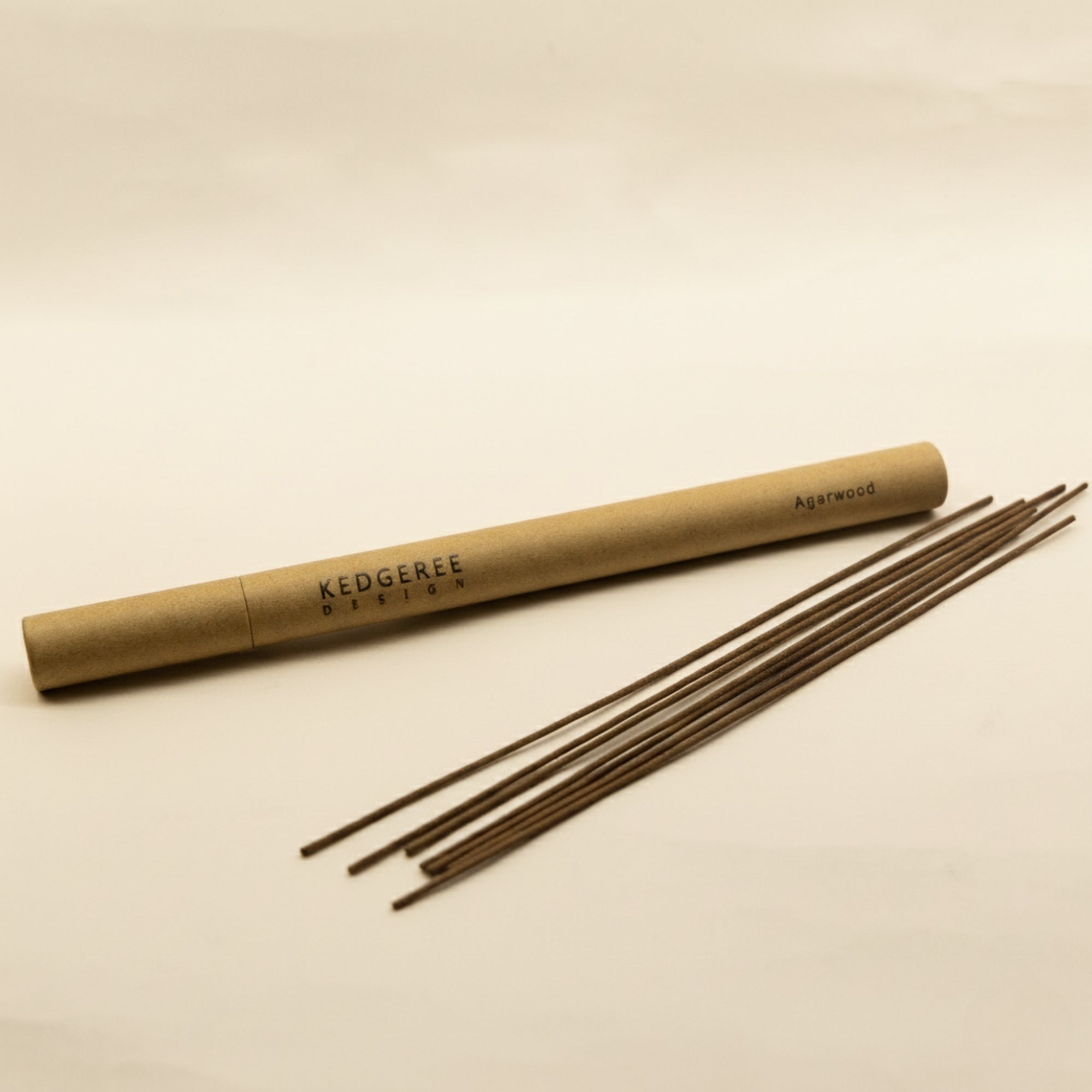 Hand-rolled incense sticks (agarwood, rose, sandalwood) with brass holder and tray.