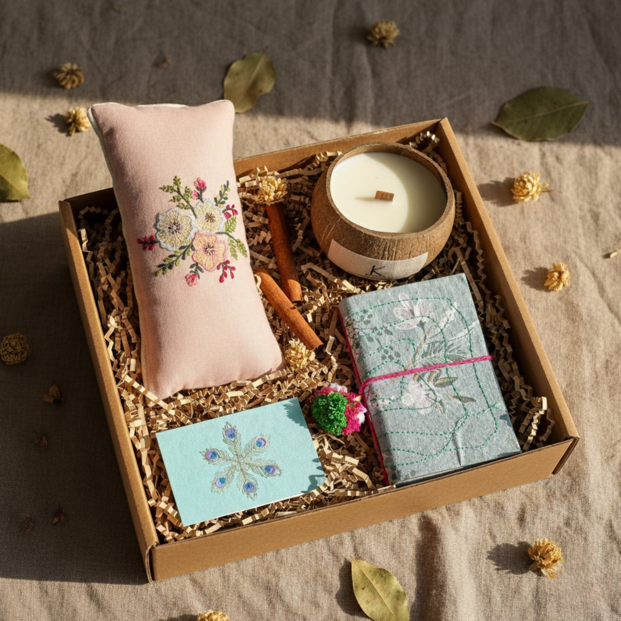 Wellness Gift box with plant based natural wax candle, an eye pillow, a handmade journal and a personalised gift card to go inside the gift box.