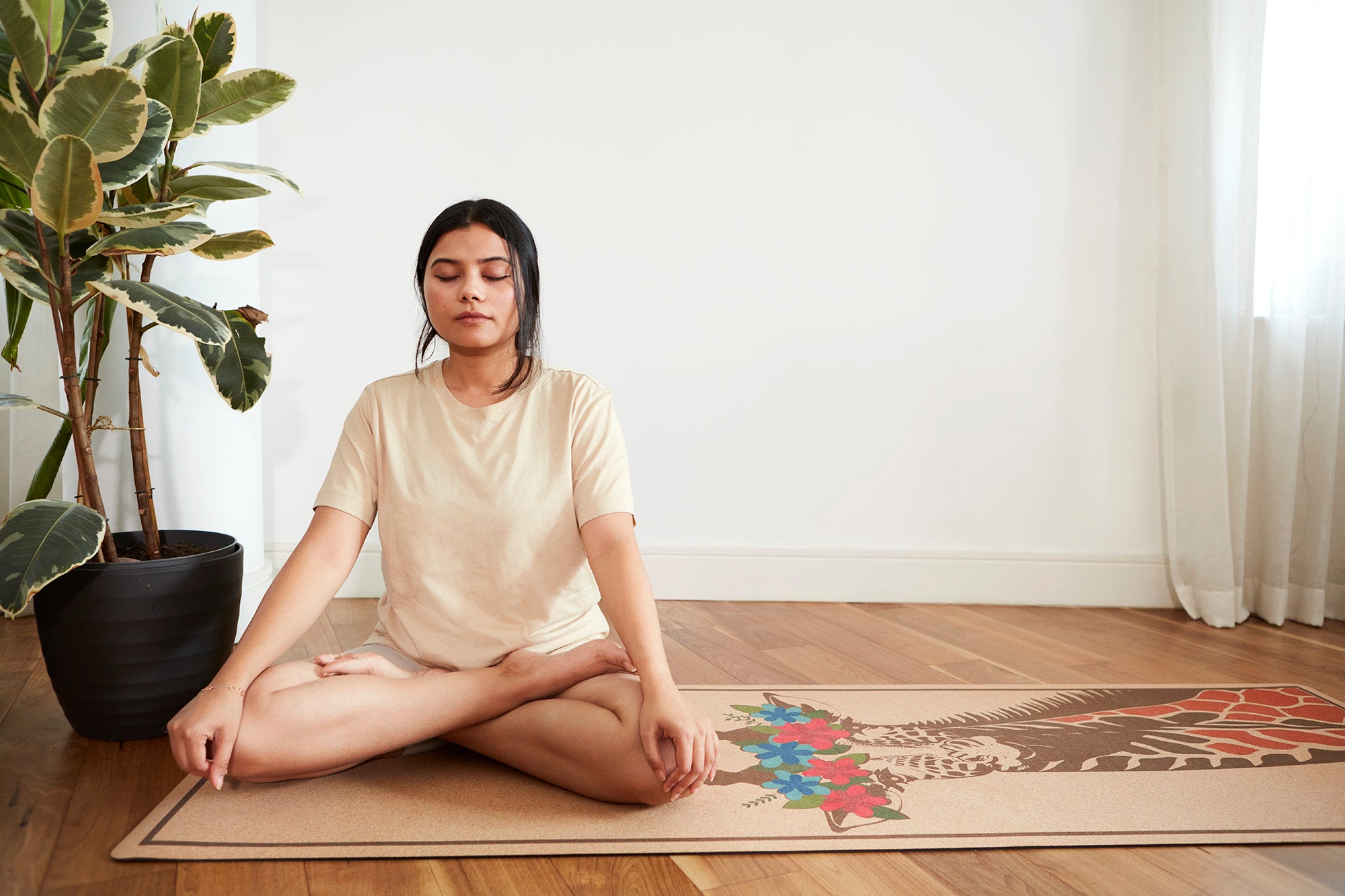 Full view of giraffe design cork yoga mat with colorful floral crown – artistic, eco-friendly, and non-toxic yoga mat