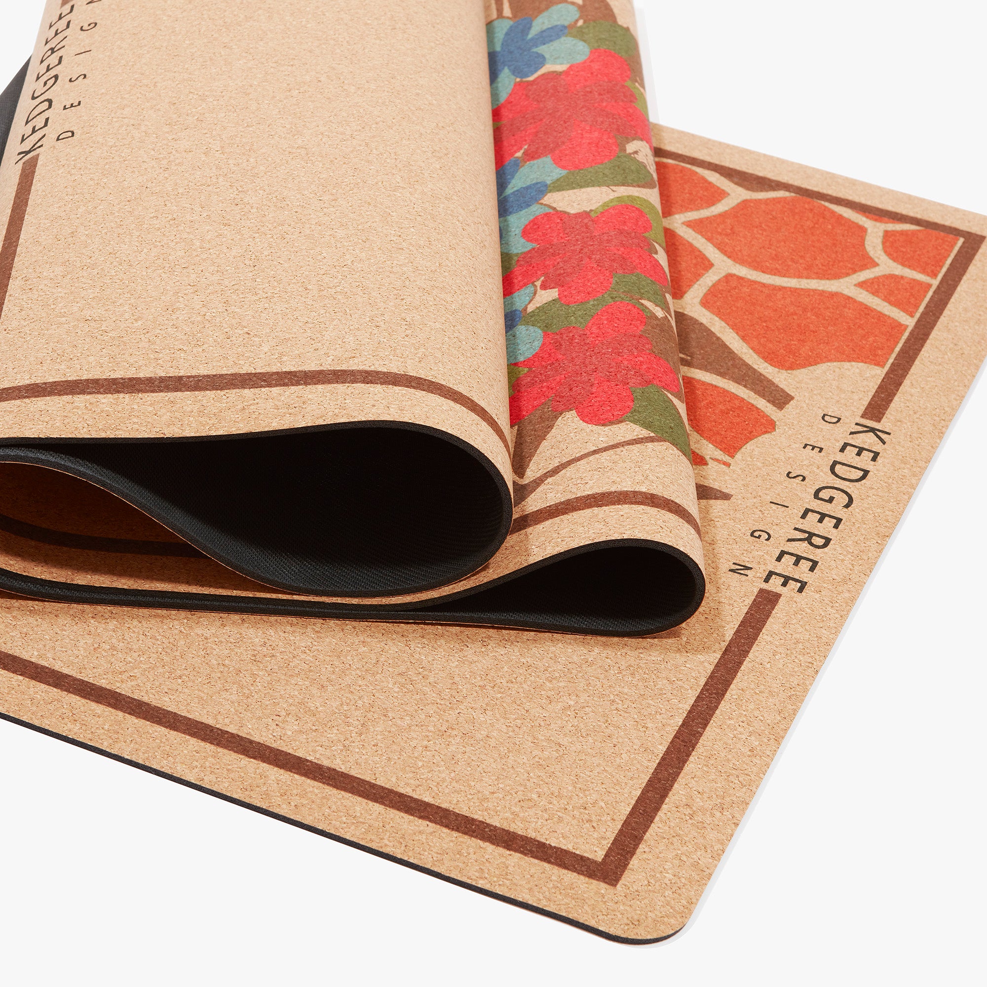 Close-up of folded giraffe cork yoga mat with floral artwork – naturally anti-slip, durable, and easy to clean.