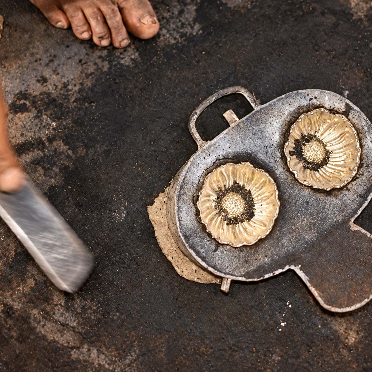 Artisan making the lotus incense holder in the small factory