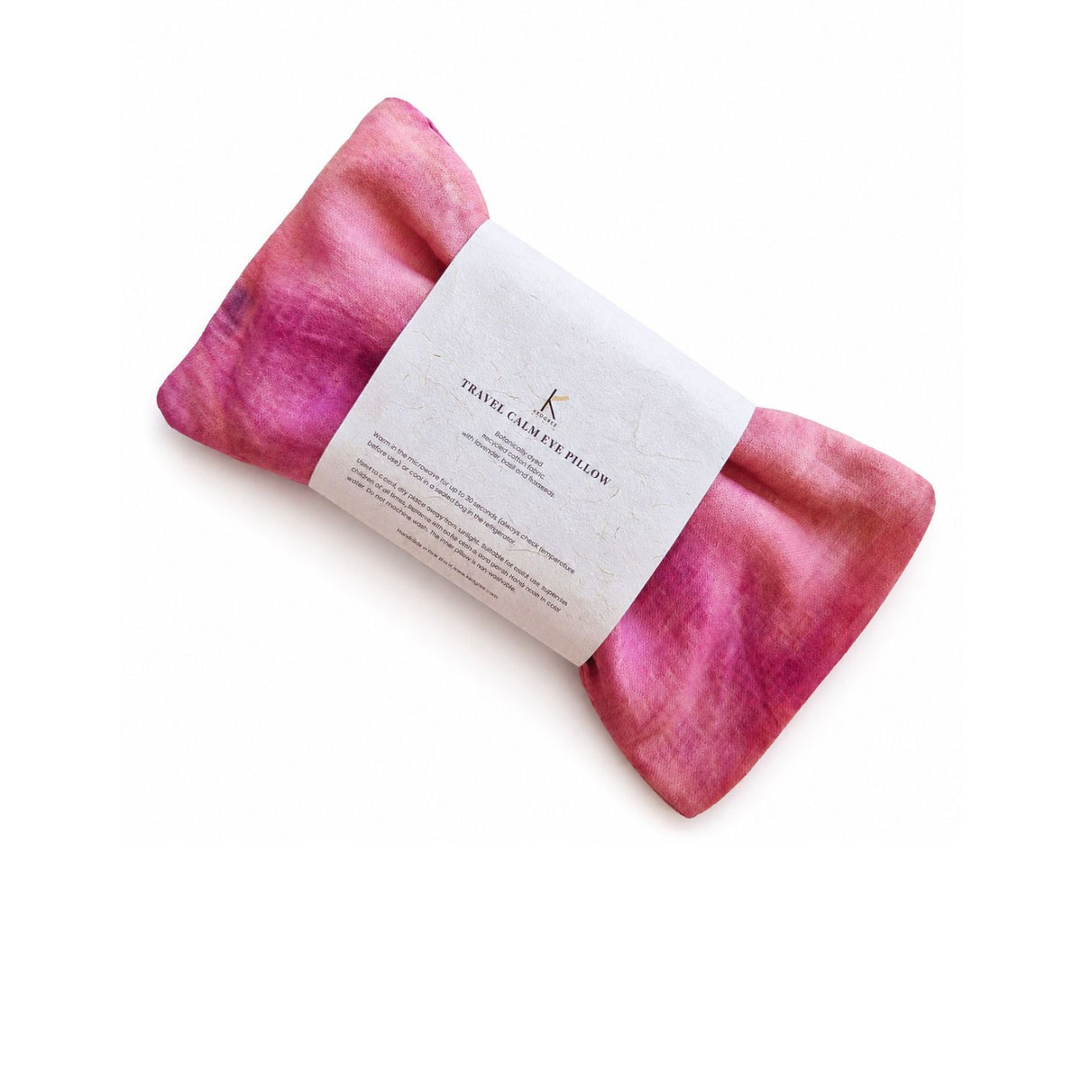 Kedgeree Botanically rose dyed Pink travel calm eye pillow with a sleeve on how to use it is placed on a white background