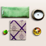 The image is our Tranquil Essence Meditation Gift Set that comes with a eco-friendly candle, tulsi mala, meditation journal,eye pillow and incense stick holder.