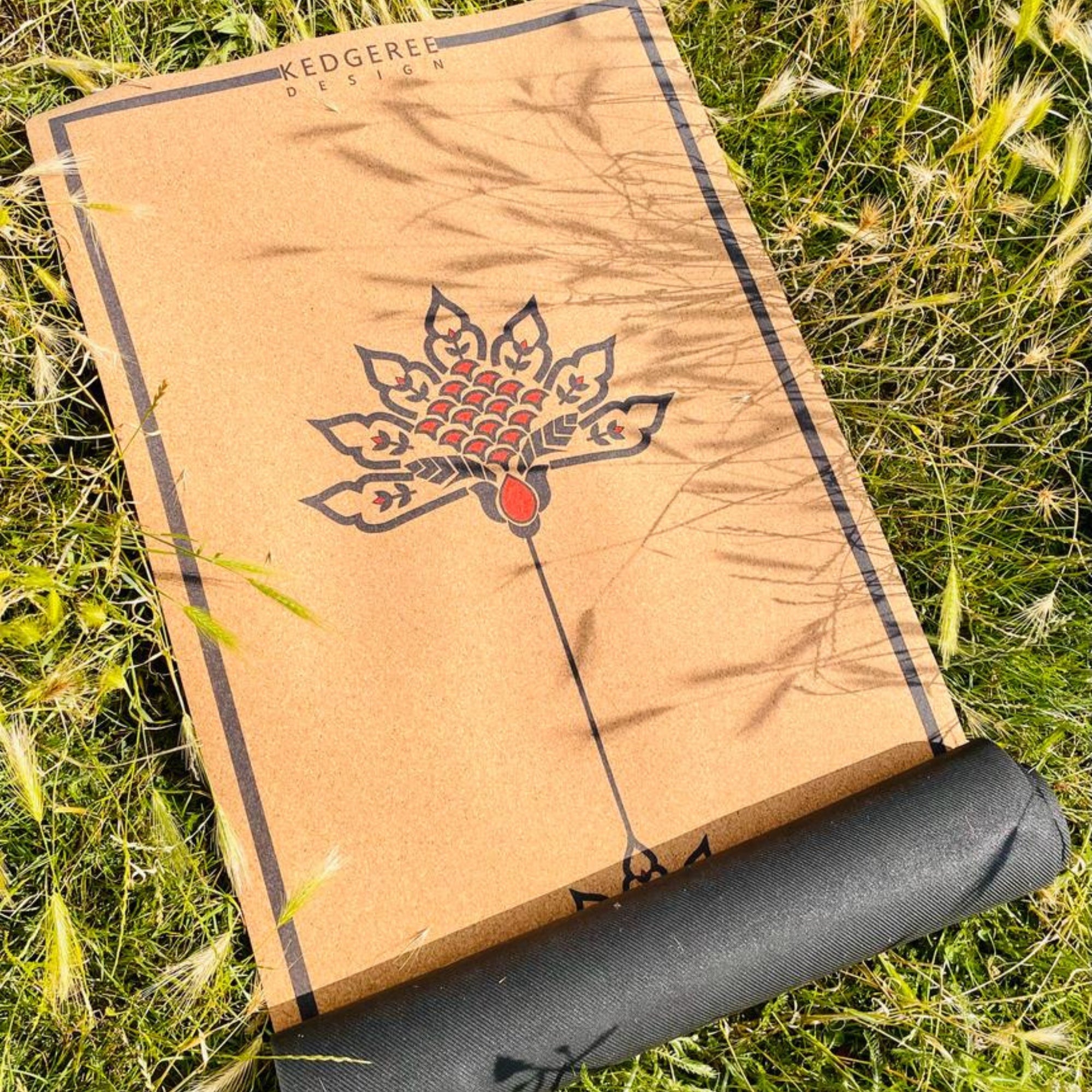 Lightweight cork yoga mat with lotus artwork – durable and perfect for practicing yoga in nature.