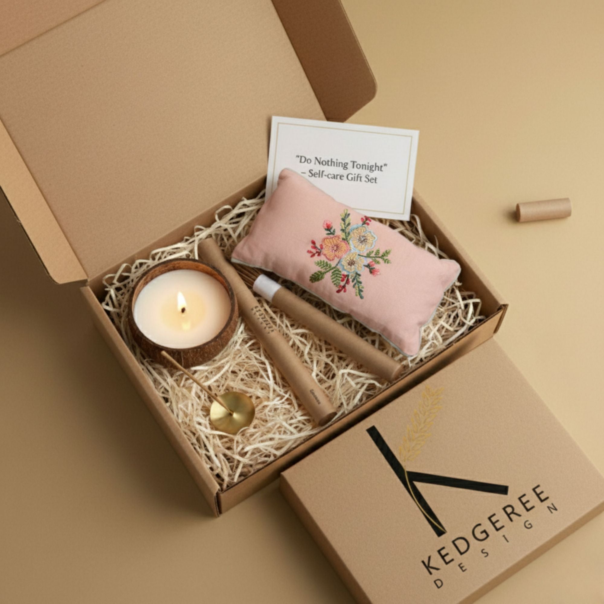 Gift set with plant based aromatherapy candle, meditation and massage eye pillow, and natural incense stick in a box labeled 'Kedgeree Design