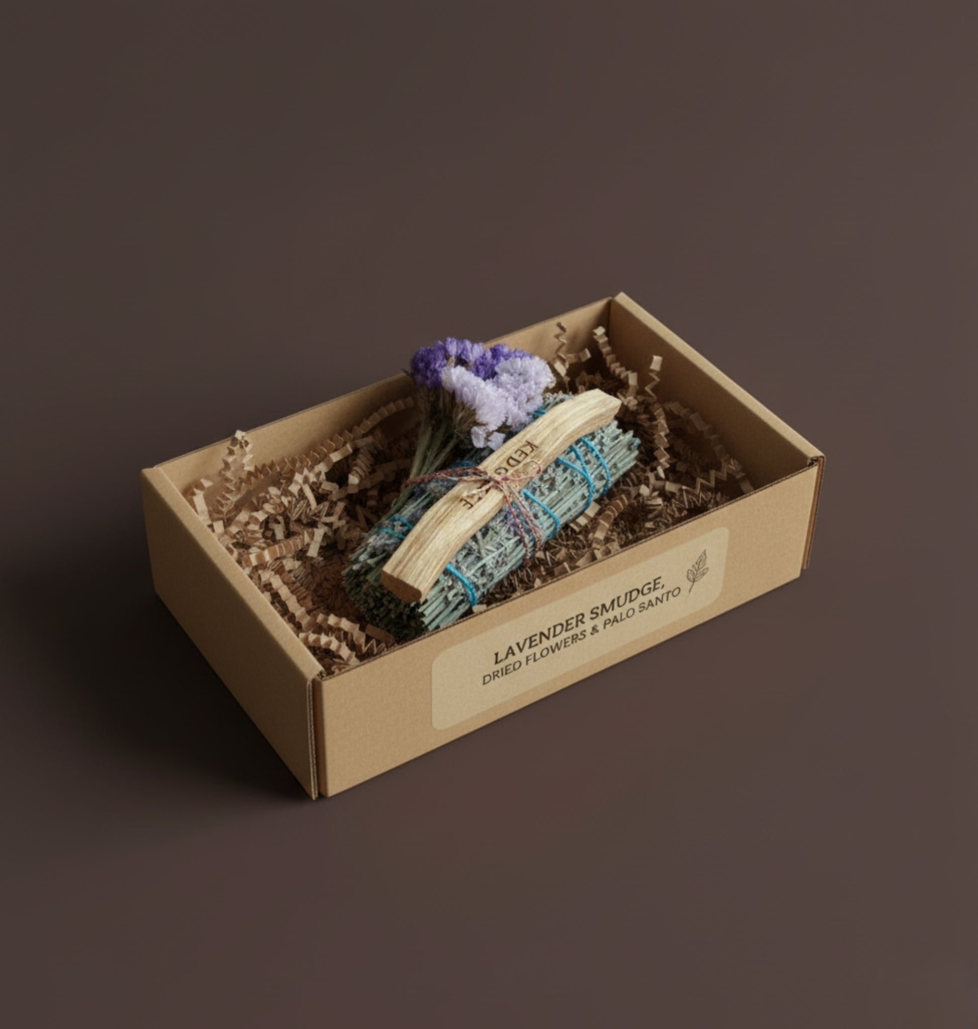 Lavender smudge kit with flowers and Palo Santo in a gift box on a brown background