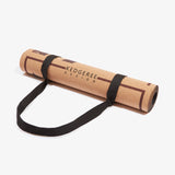 Rolled up cork yoga mat with free strap