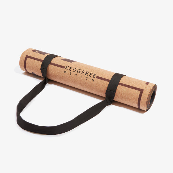 Rolled up cork yoga mat with free strap