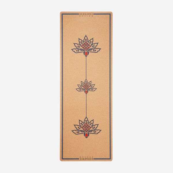 The travel cork yoga mat with beautiful lotus design in it