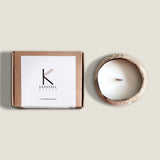 Sustainable coconut shell candle made with plant wax and essential oils