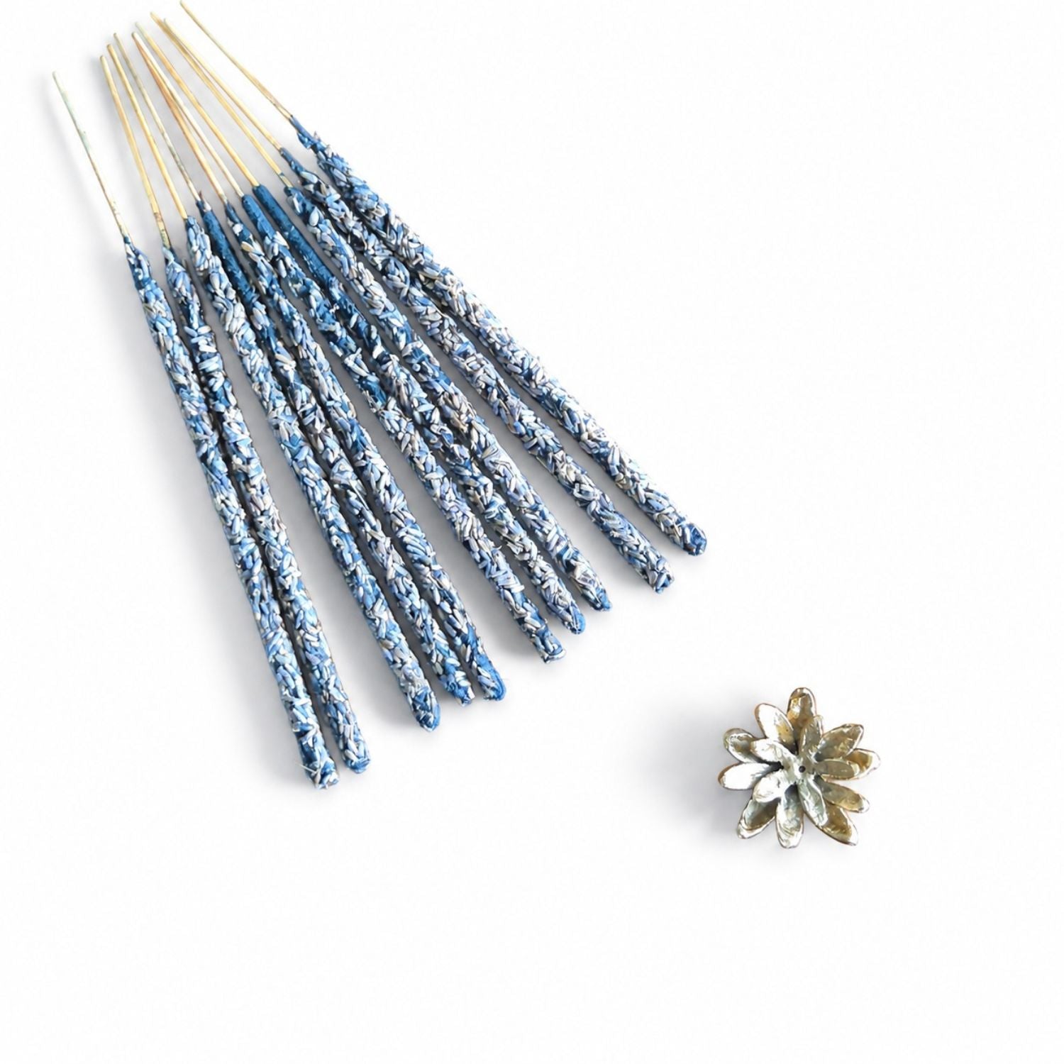 Kedgeree Lavender Floral Hand-rolled incense laid flat against a white backdrop with a flower pattern incense holder