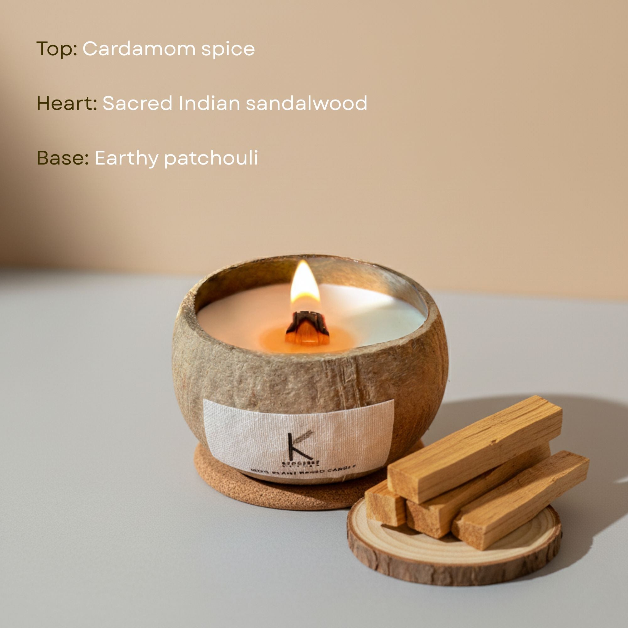 Natural Candle in a coconut shell with wooden sticks on a neutral background