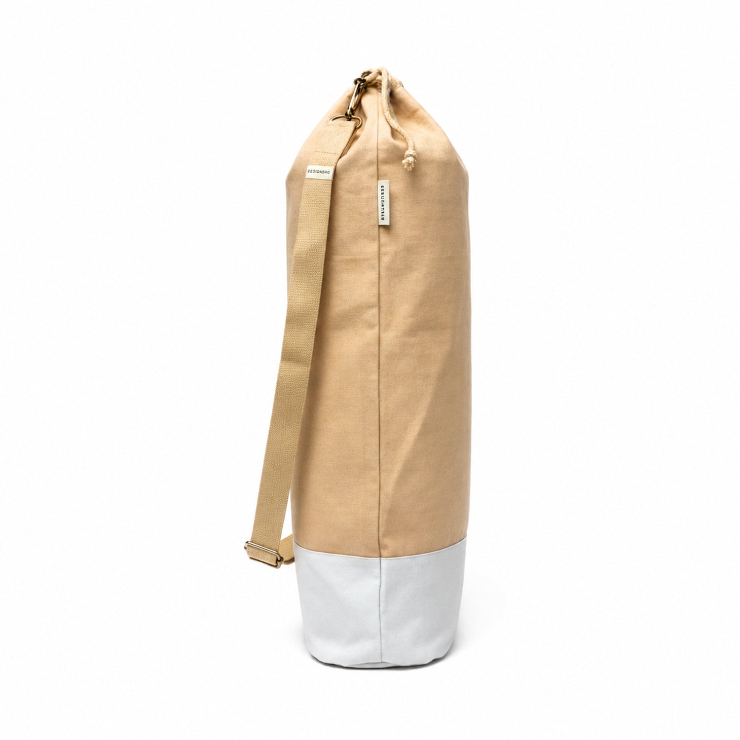 beige yoga bag with adjustable strap on white bg