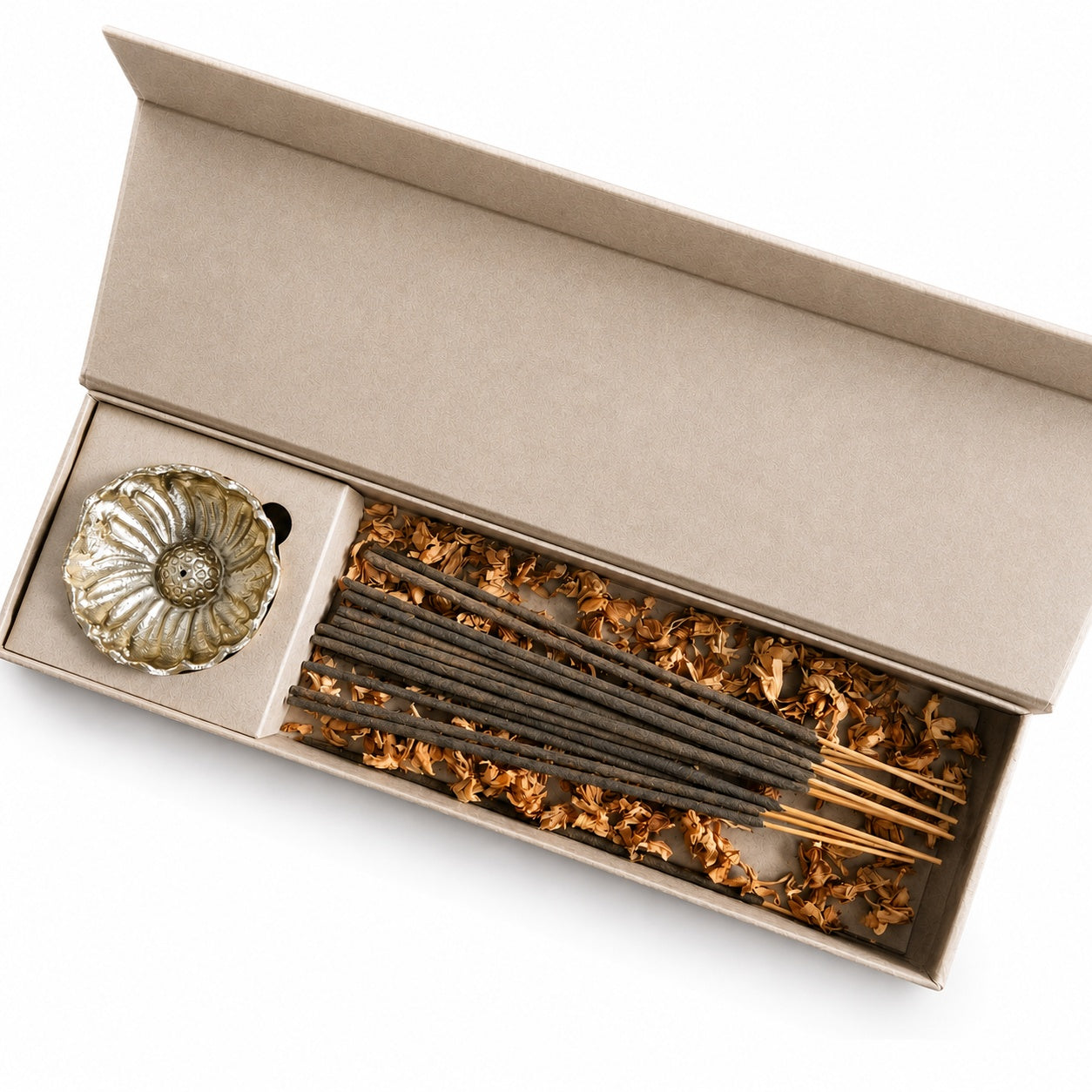An open kraft paper gift box containing oudh incense sticks and a brass incense holder, photographed on a clean white background.