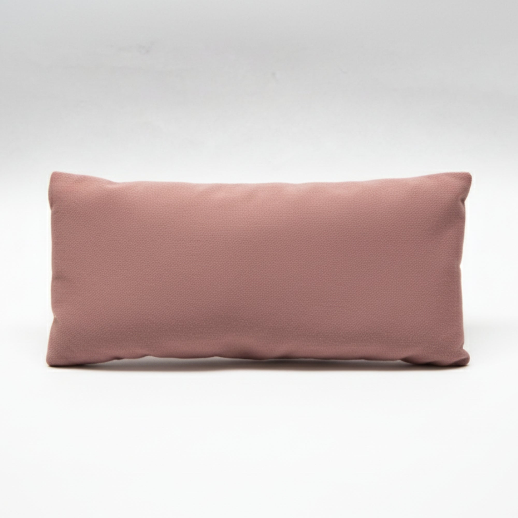 Pink  yoga and meditation eye pillow on a white background